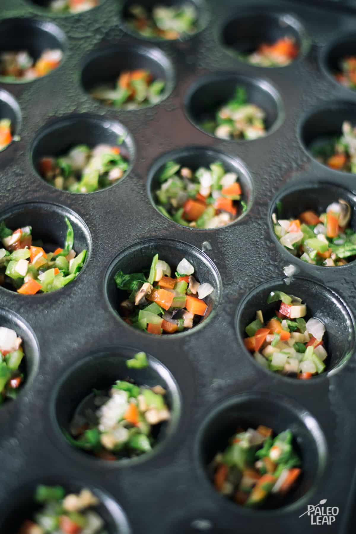 https://paleoleap.com/wp-content/uploads/2016/08/eggs-vegetables-muffin-cups-preparation.jpg