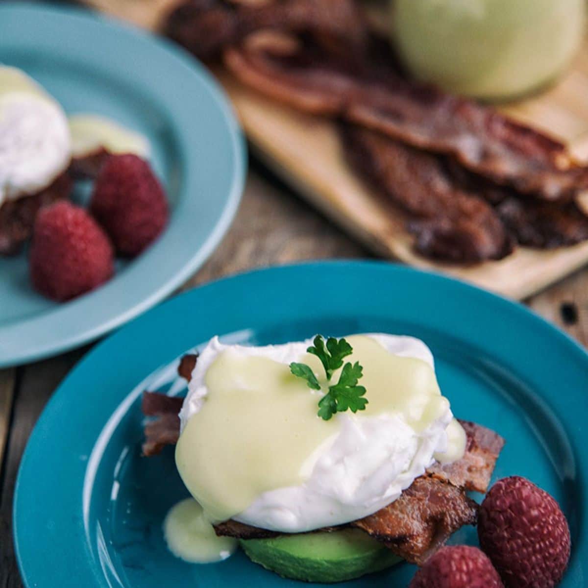 Eggs Benedict With Avocado And Bacon Featured