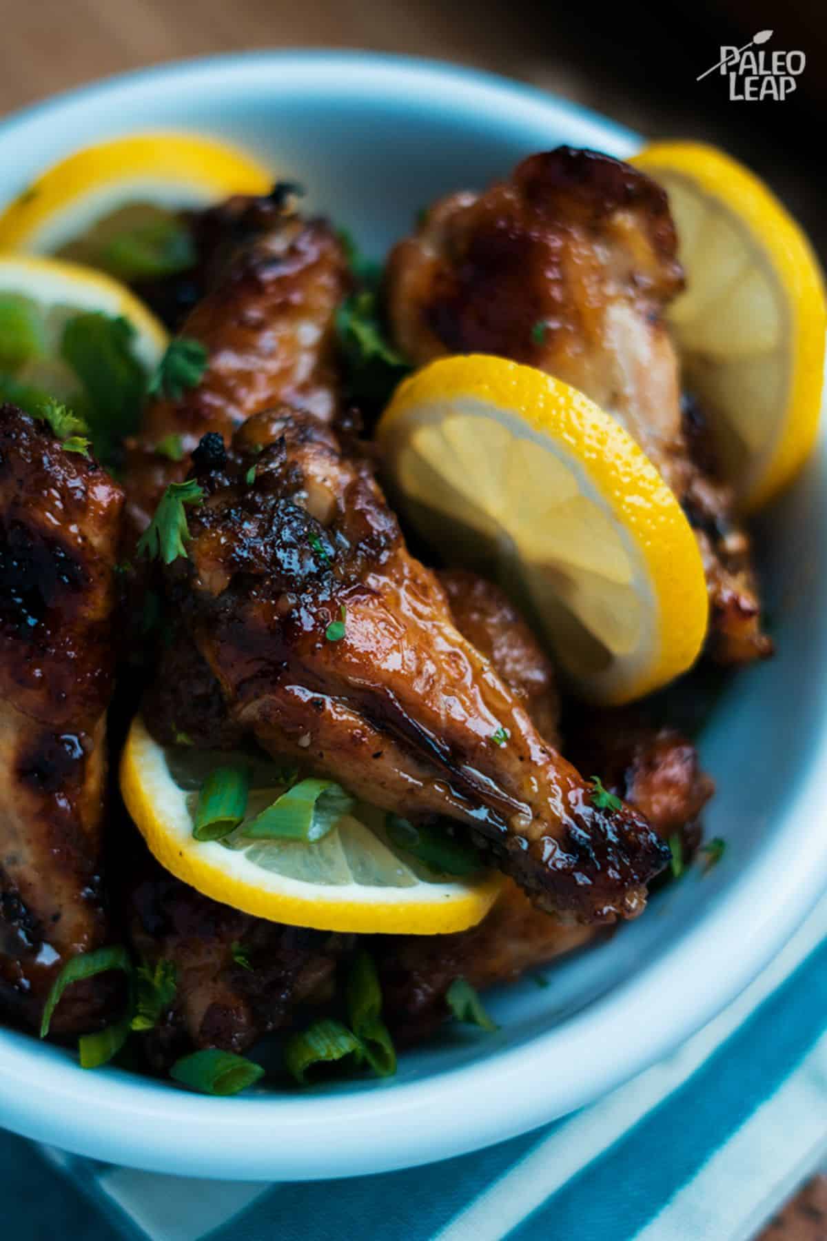 Lemon And Honey Glazed Chicken Wings in a blue bowl.