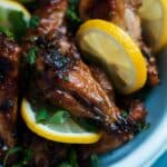 Lemon And Honey Glazed Chicken Wings in a blue bowl.
