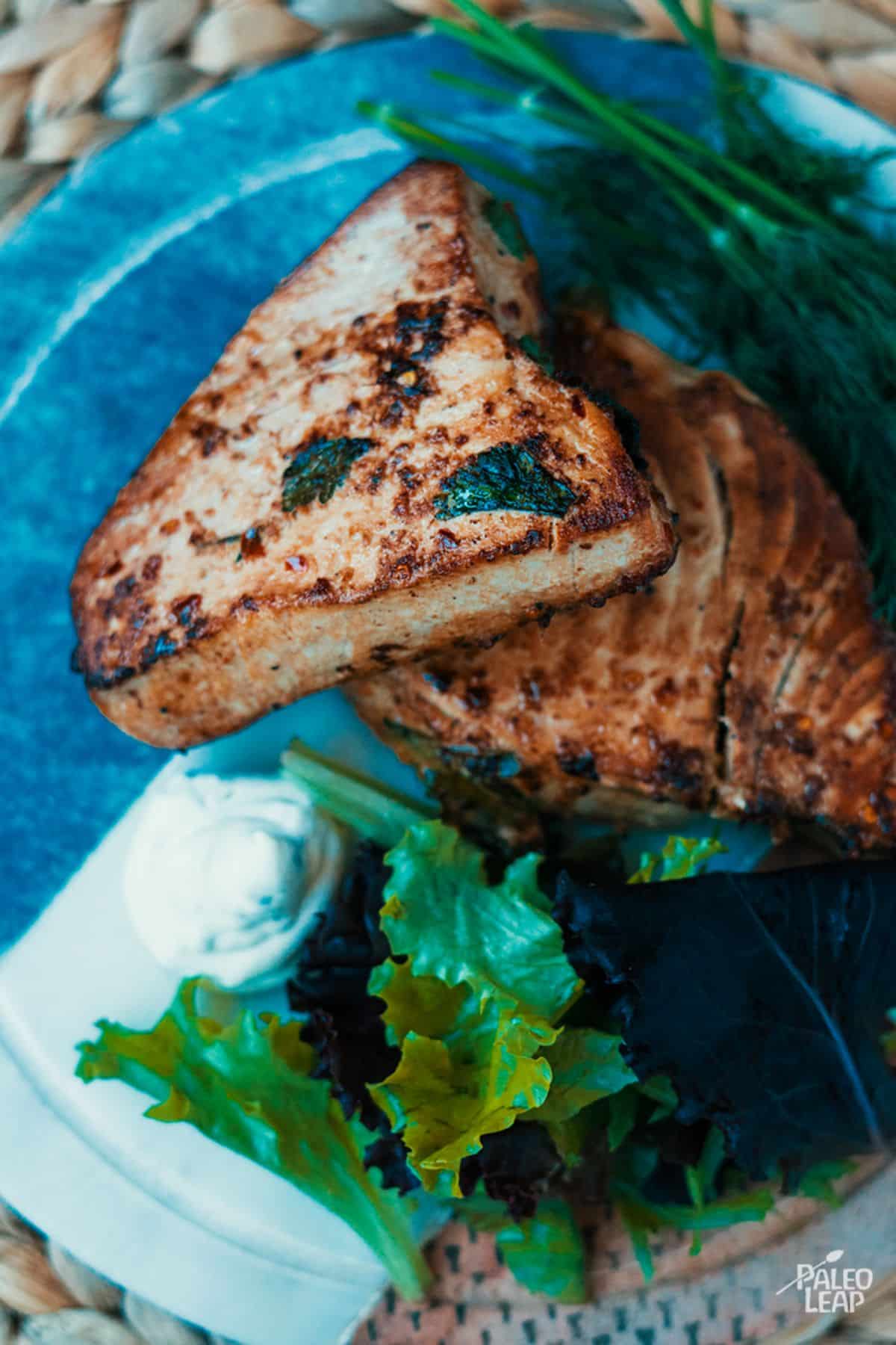 Marinated Asian-Style Tuna Steaks on a blue plate.