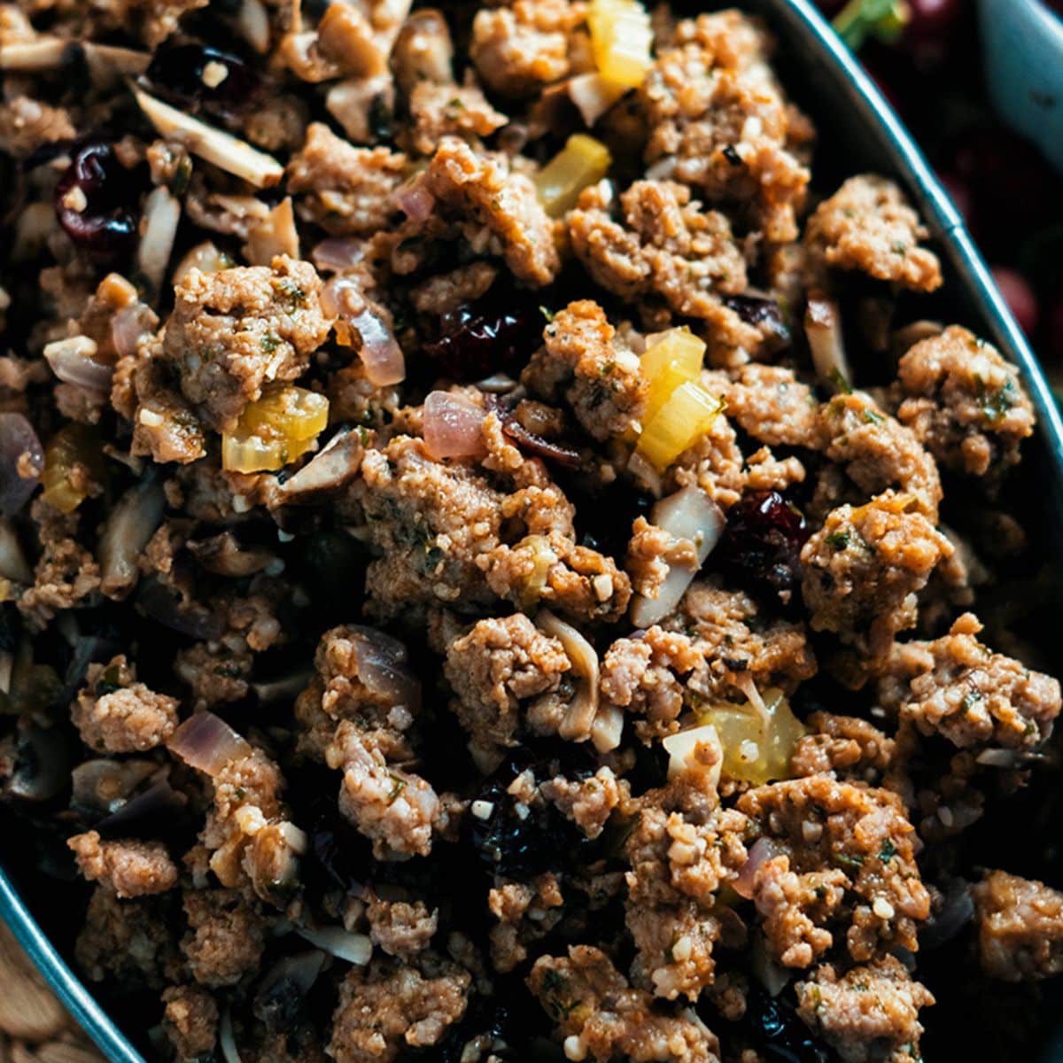 Sausage And Herb Stuffing in a blue bowl.