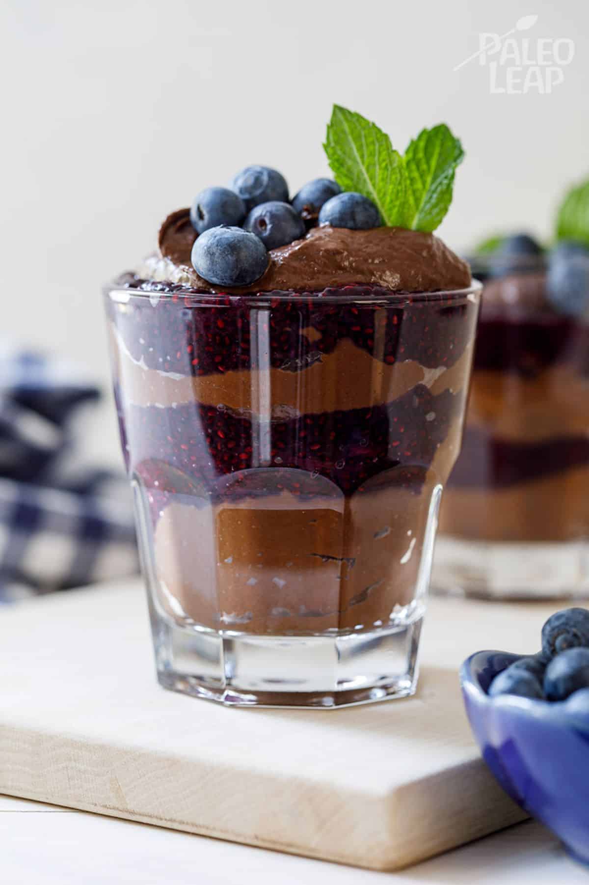 Blueberry Chocolate Chia Parfait in a glass cup.