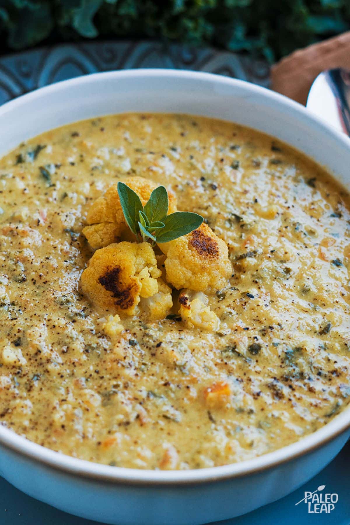 Curried Cauliflower And Kale Soup in a bowl.