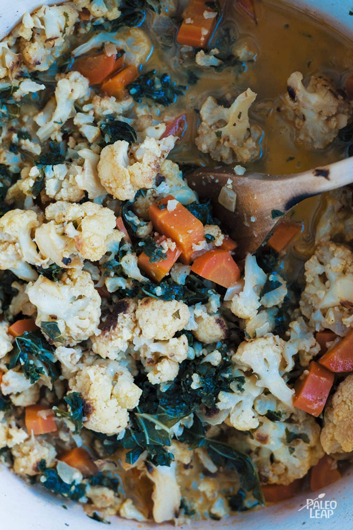 Curried Cauliflower And Kale Soup preparation.