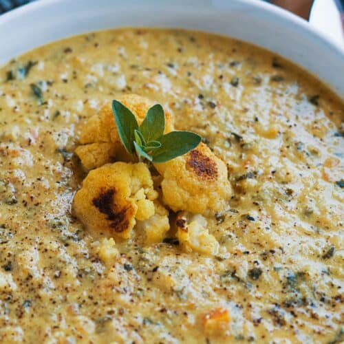 Curried Cauliflower And Kale Soup in a bowl.