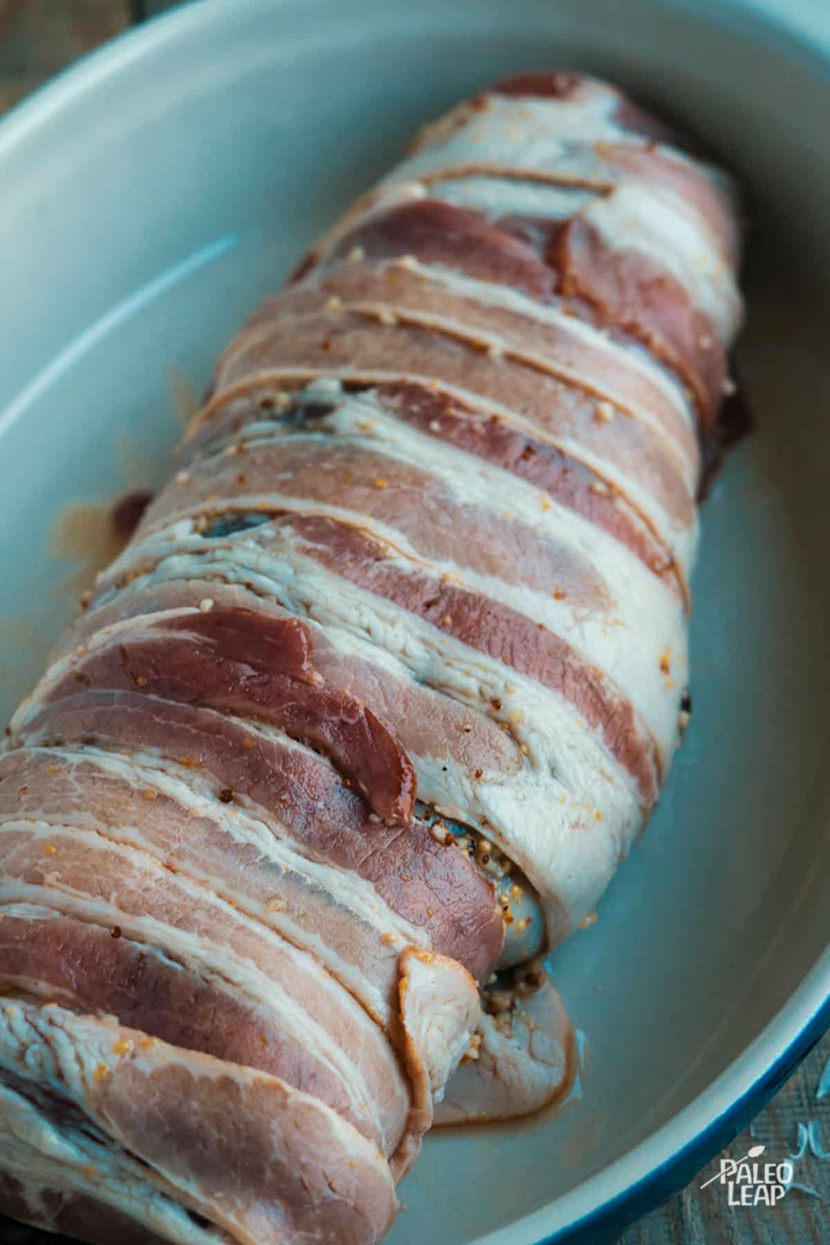 Honey-Dijon Bacon Wrapped Tenderloin preparation.