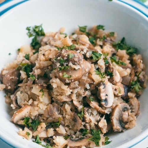 Cauliflower Mushroom Risotto in a white bowl.