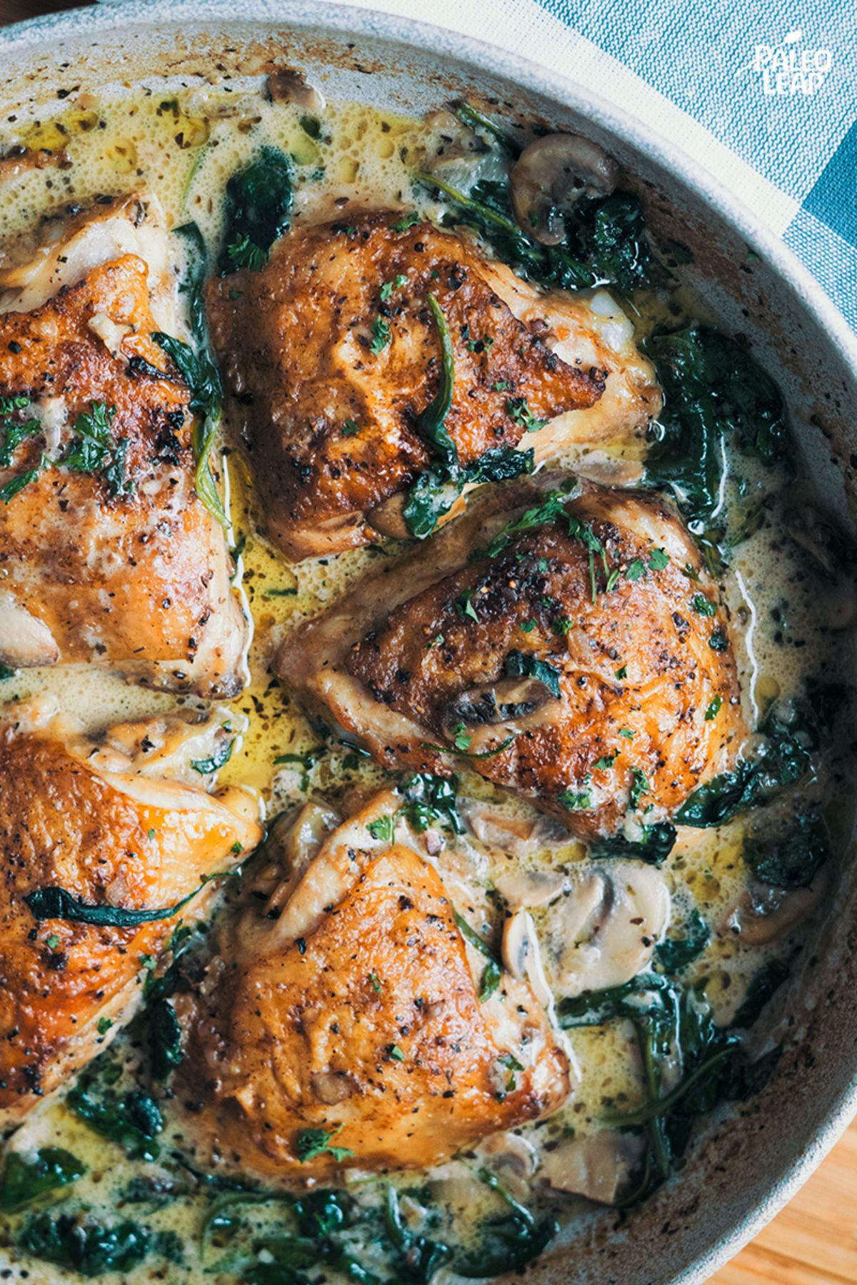Creamy Mushroom and Spinach Chicken in a pan.