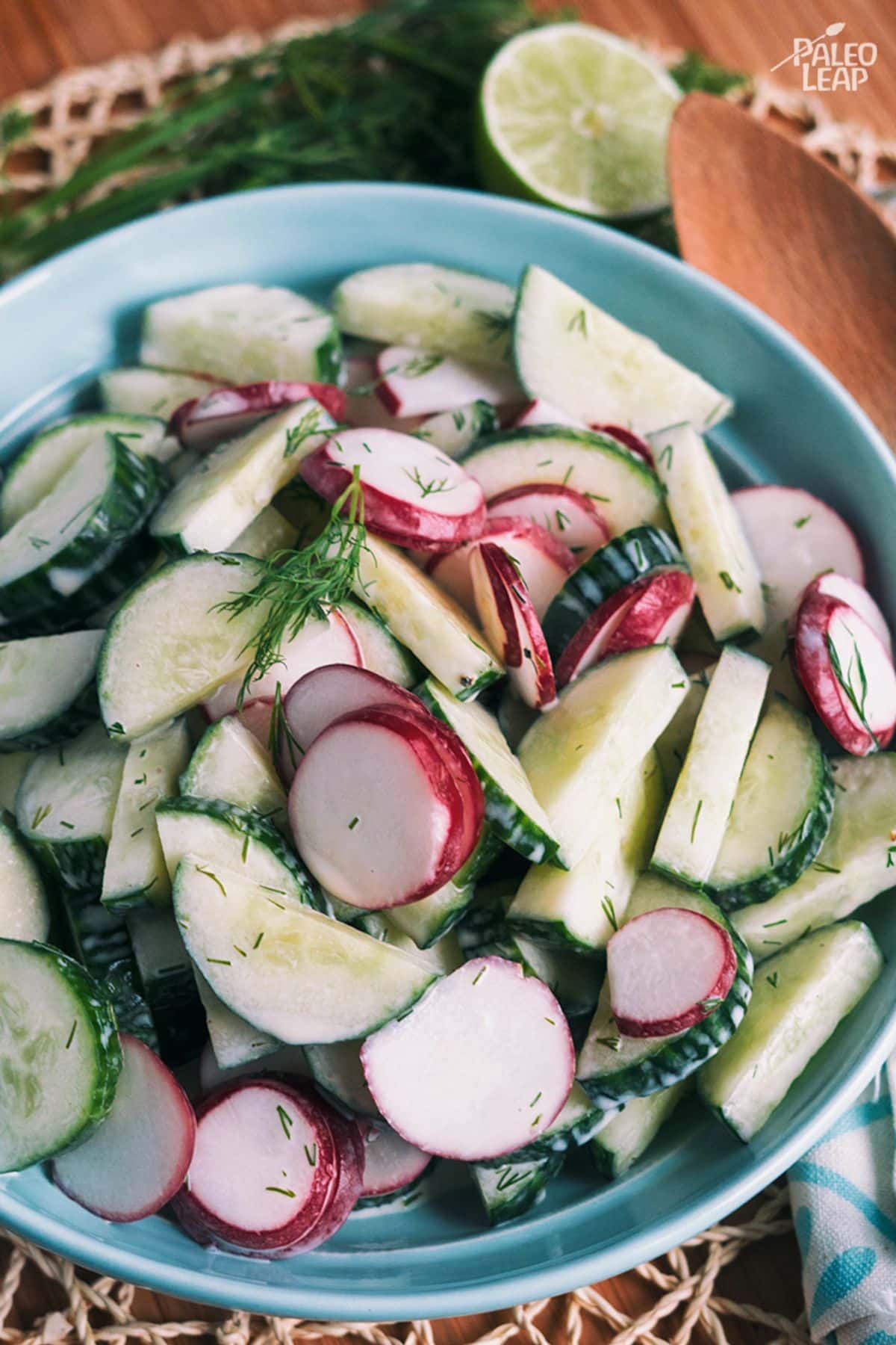 Cucumber And Radish Salad in a blue bowl.