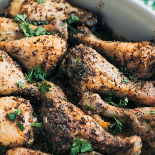 Roasted Dried Herb Drumsticks in a white bowl.