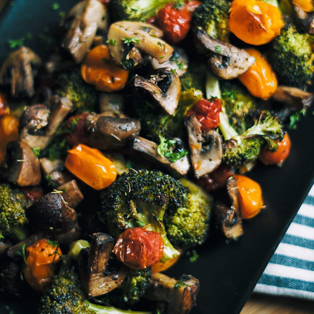 Roasted Vegetables With Italian Herbs on a baking tray.