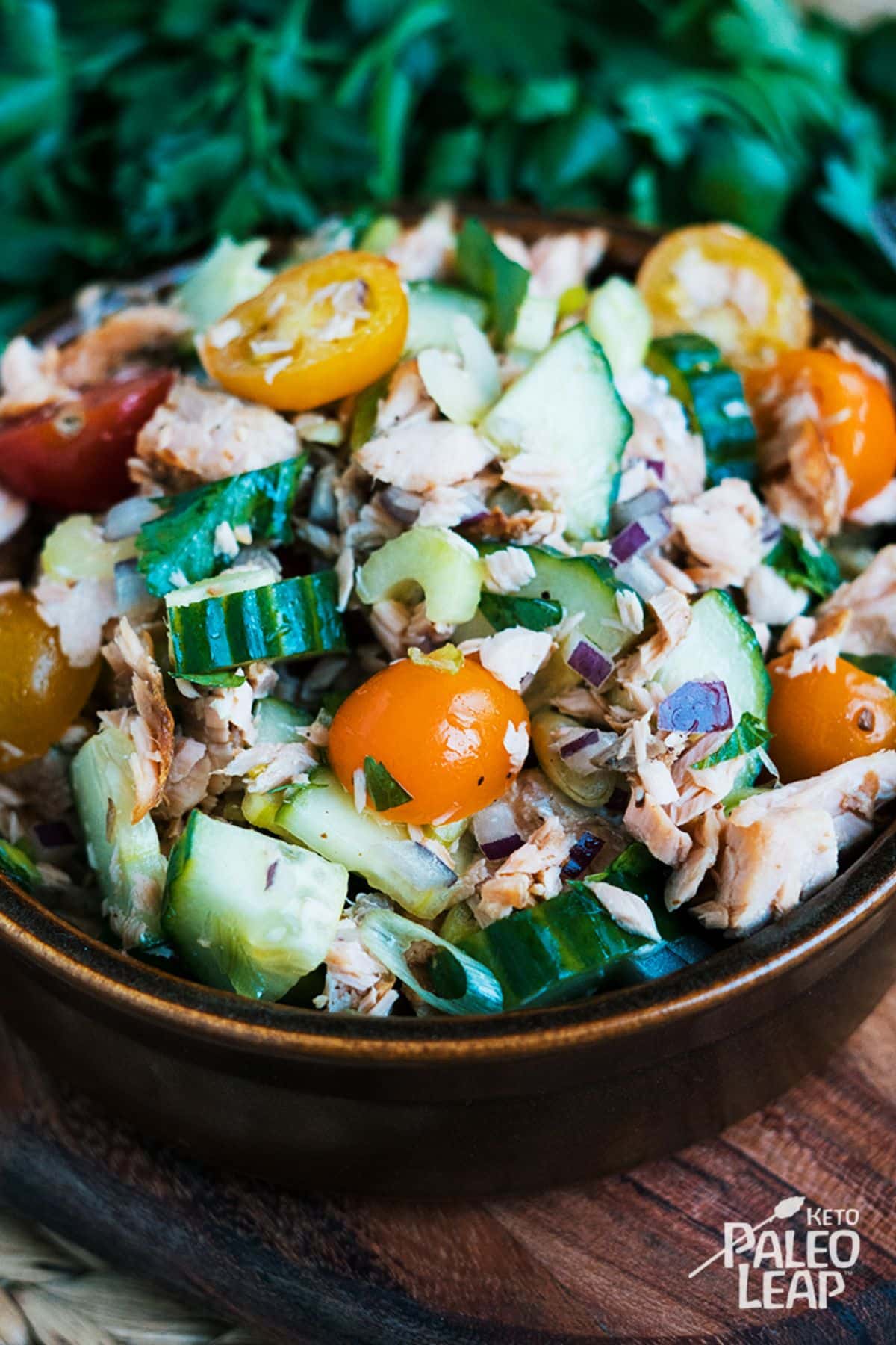 Keto Salmon Chopped Vegetable Salad  in a brown bowl.