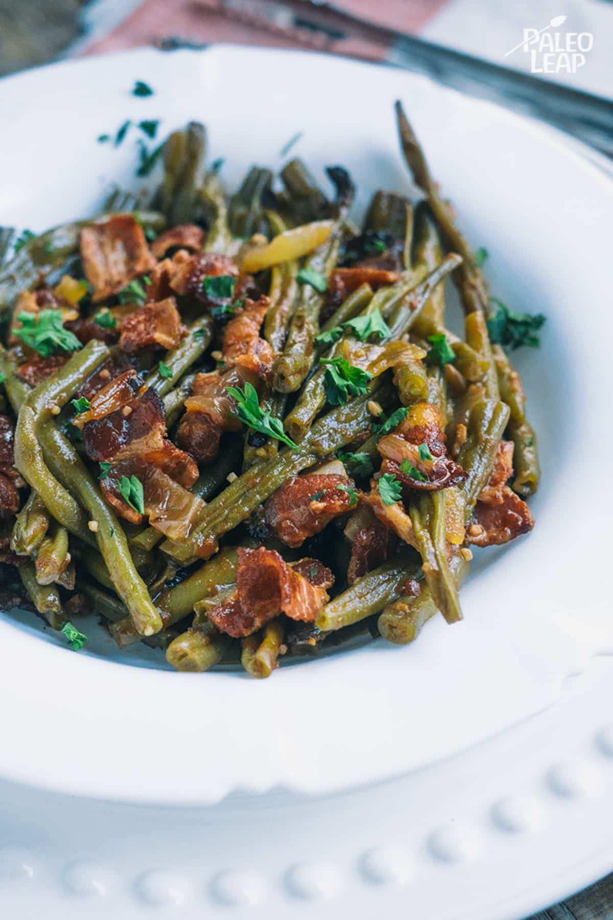 Slow Cooker BBQ Bacon Green Beans on a white plate.