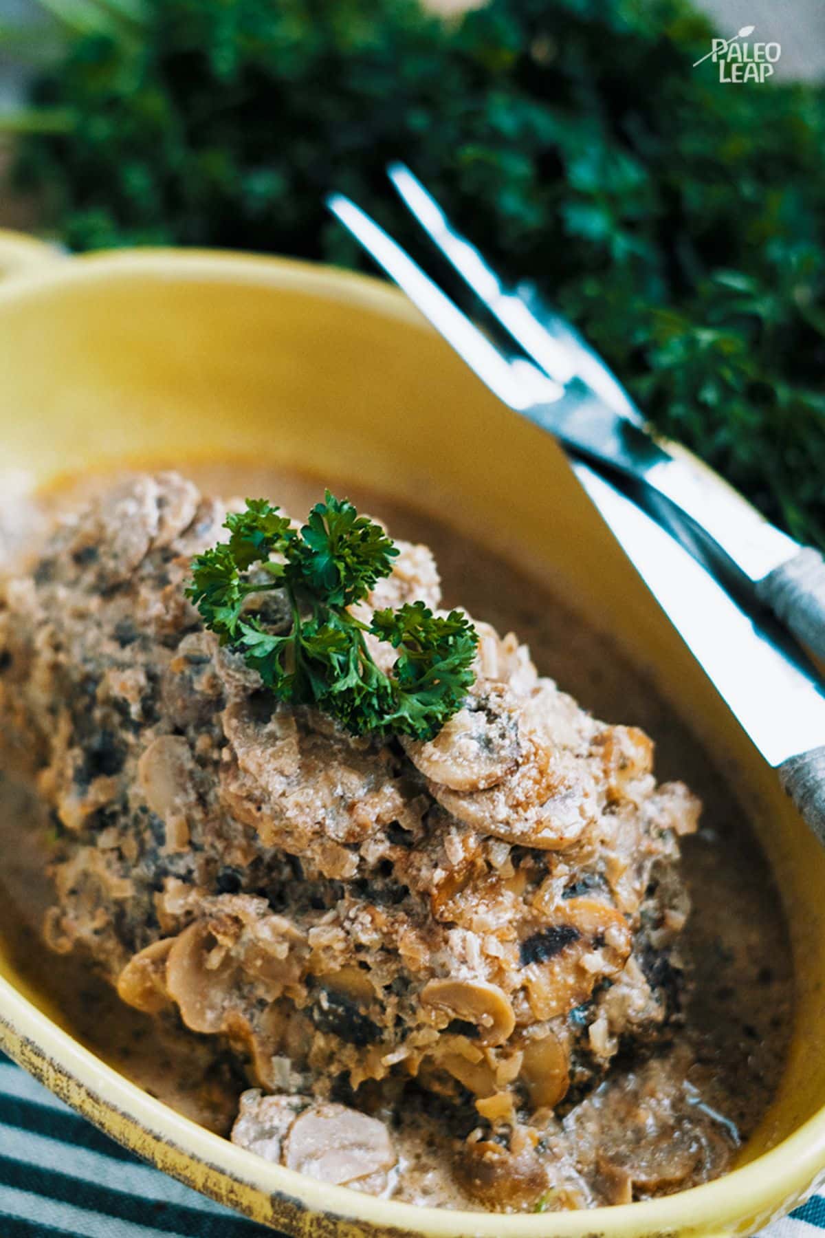 Slow Cooker Beef With Mushroom-Onion Sauce Recipe in a yellow bowl.