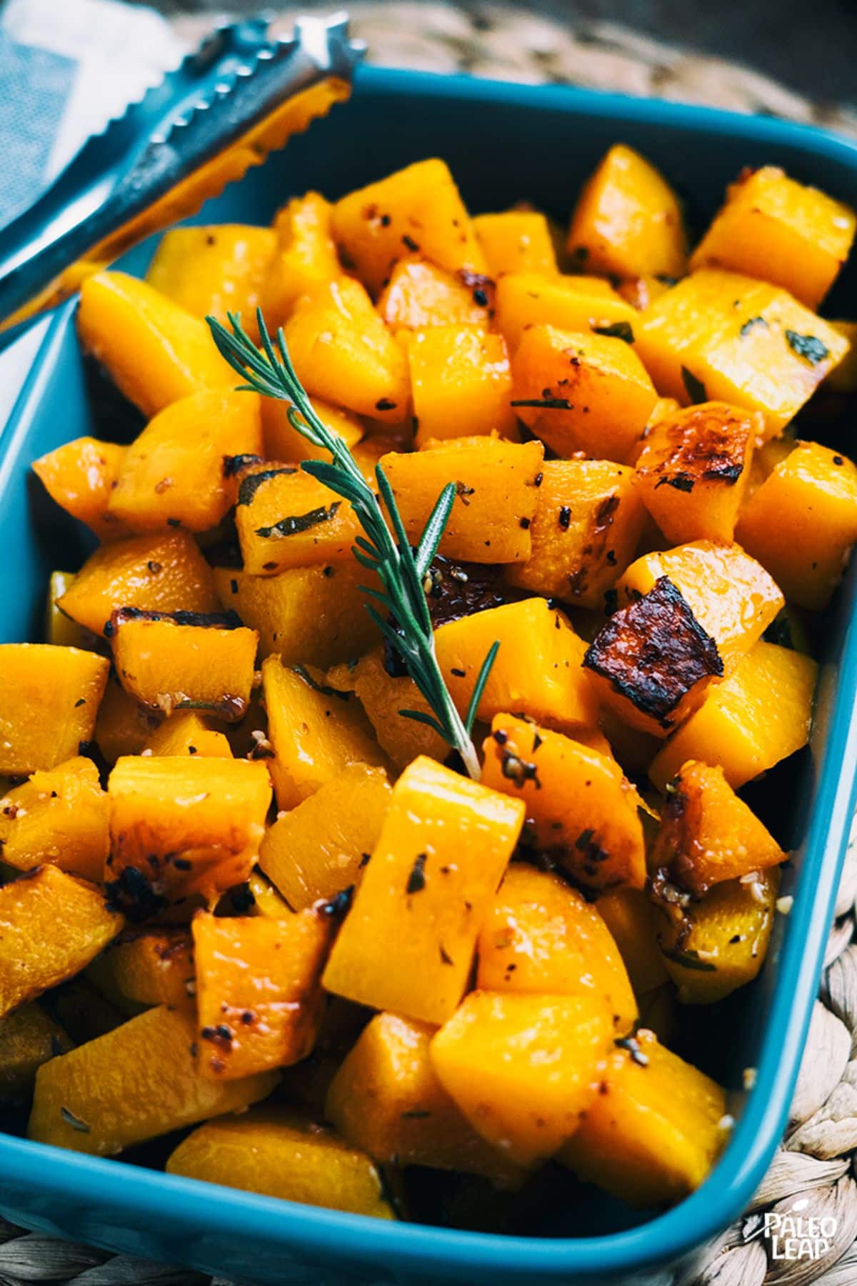 Garlic And Herb Roasted Butternut Squash in a blue casserole.