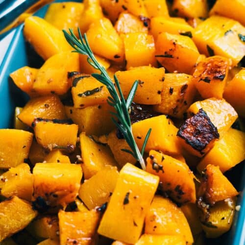 Garlic And Herb Roasted Butternut Squash in a blue casserole.