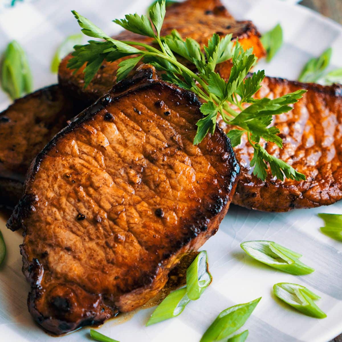 Blueberry Glazed Pork Chops on a white plate.