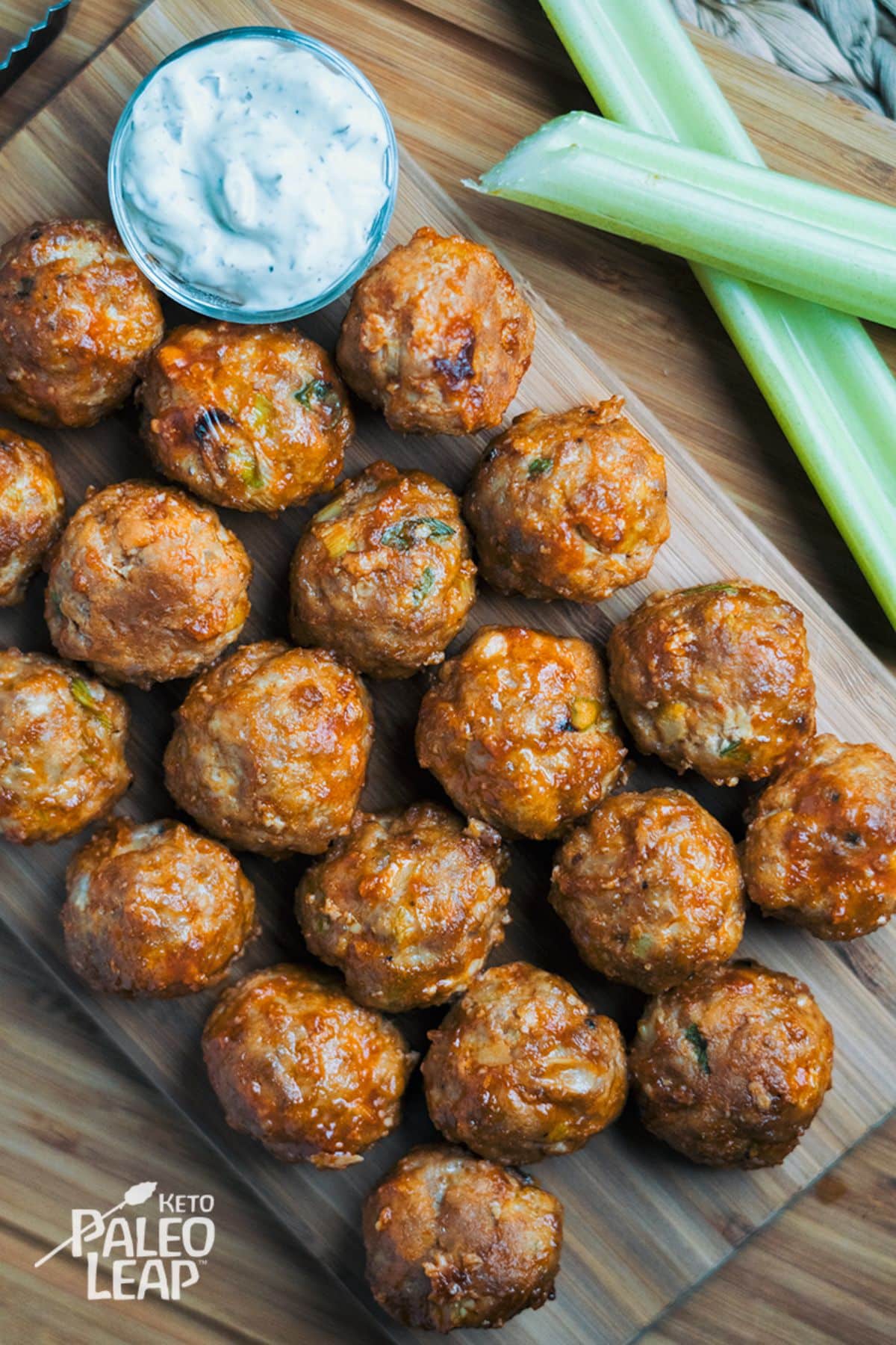 Keto Buffalo Chicken Meatballs on a wooden cutting board.