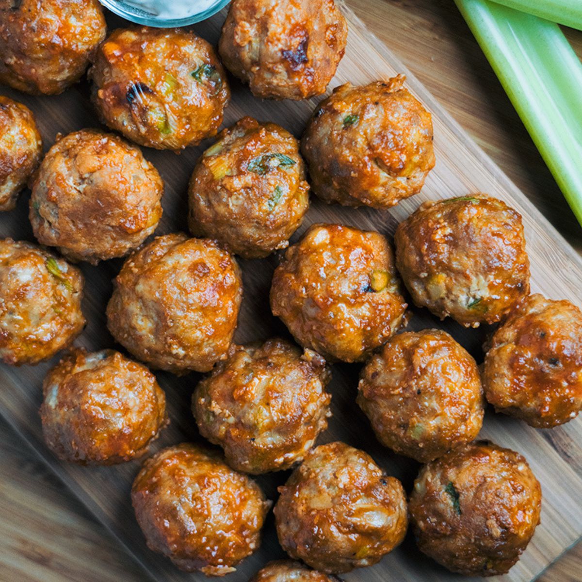 Keto Buffalo Chicken Meatballs on a wooden cutting board.