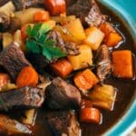 Slow Cooker Beef And Rutabaga Stew in a blue bowl.