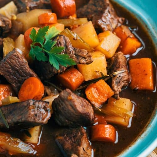 Slow Cooker Beef And Rutabaga Stew in a blue bowl.