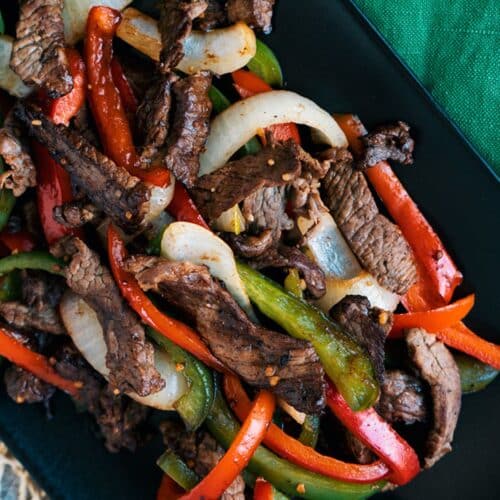 Steak And Pepper Skillet on a black tray.