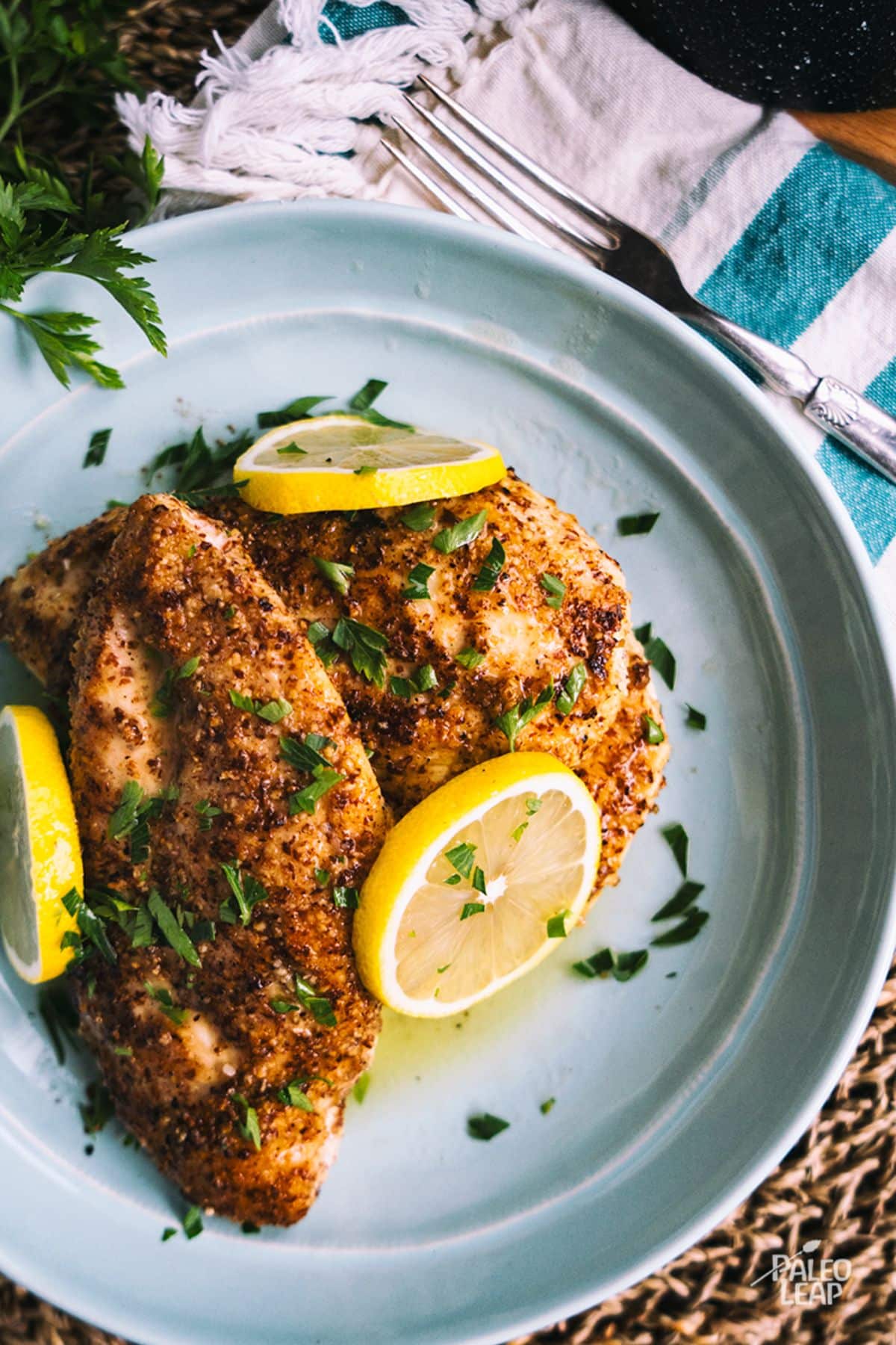 Lemon Pepper Chicken on a blue plate.