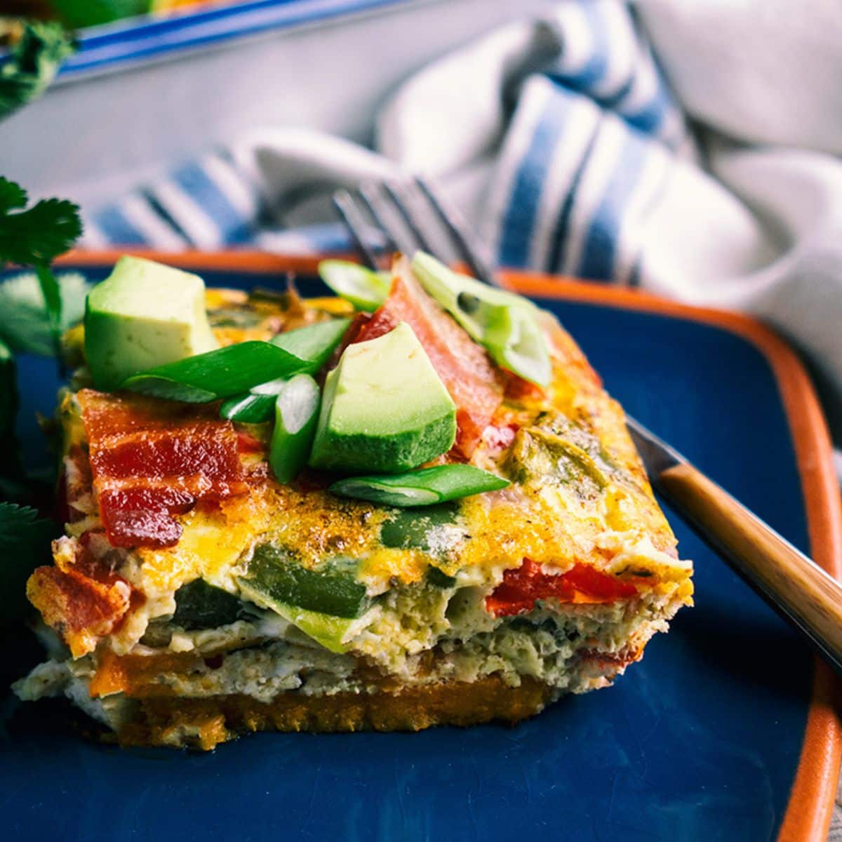 Mexican-Style Breakfast Lasagna on a plate with a fork.