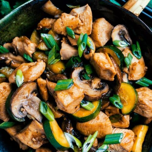 Chicken, Zucchini, And Mushroom Stir-Fry in a pan.