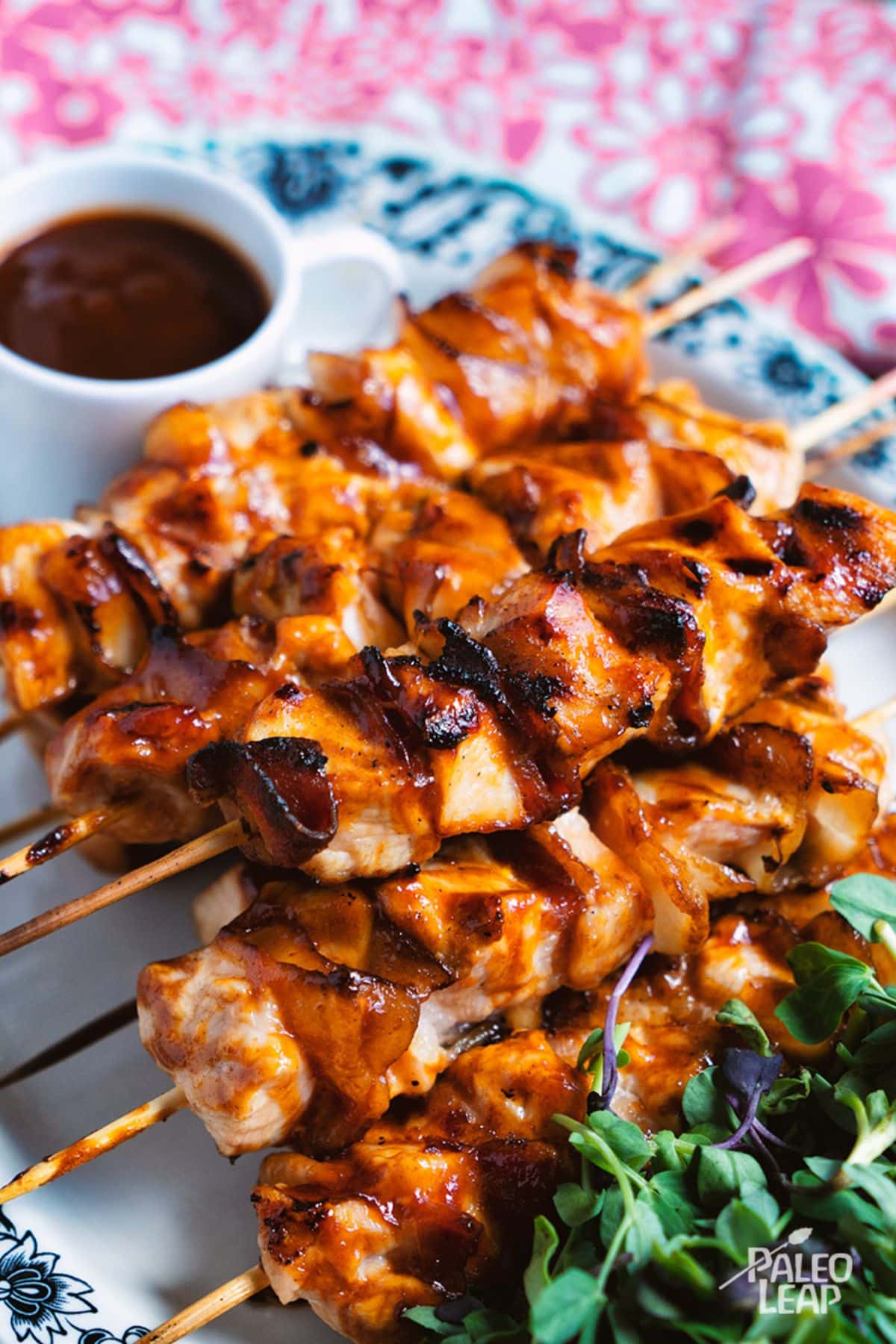 BBQ Chicken And Bacon Skewers on a tray.