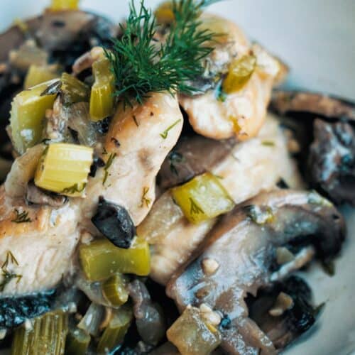 Country Style Chicken And Mushrooms in a white bowl.