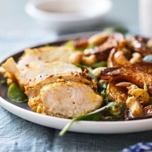 Indian-Spiced Chicken and Roasted Butternut Salad on a white plate.