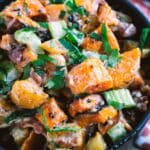 Roasted Sweet Potato Salad With Lime Dressing in a black bowl.