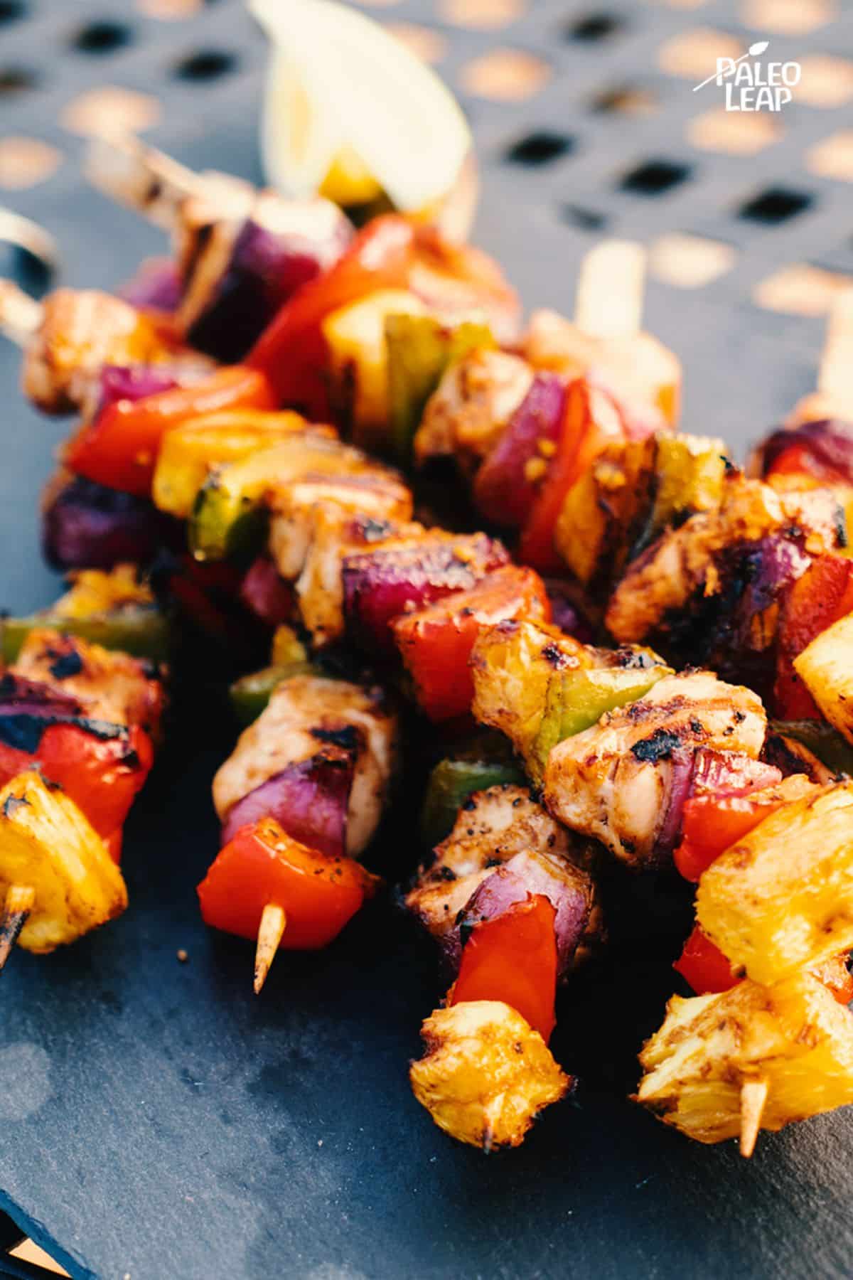 Hawaiian-Style Chicken Skewers on a table.