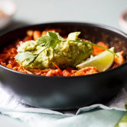 Shredded Chicken Chili in a black bowl.