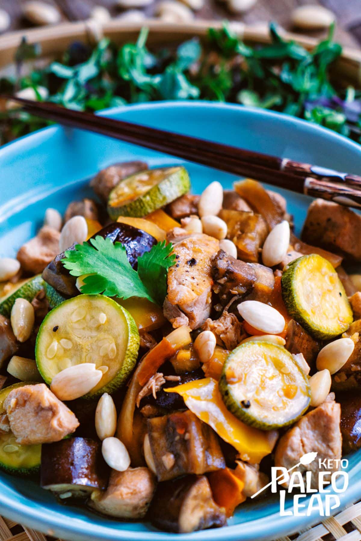 Keto Slow Cooker Kung-Pao Chicken in a blue bowl.