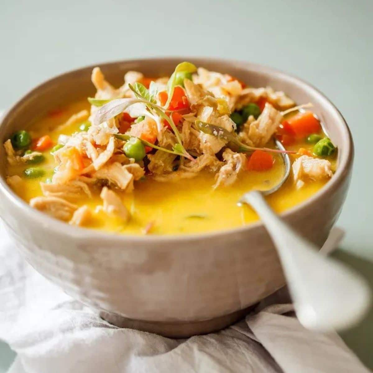 Paleo Chicken Pot Pie Soup in a white bowl.