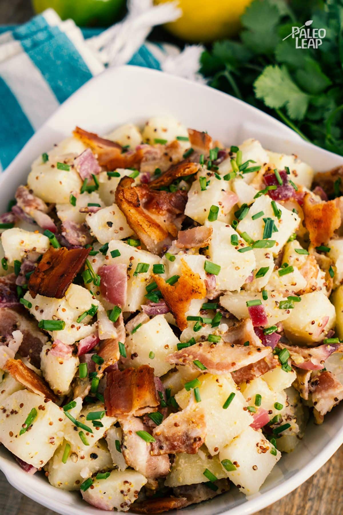 Grainy-Mustard And Bacon Potato Salad in a white bowl.