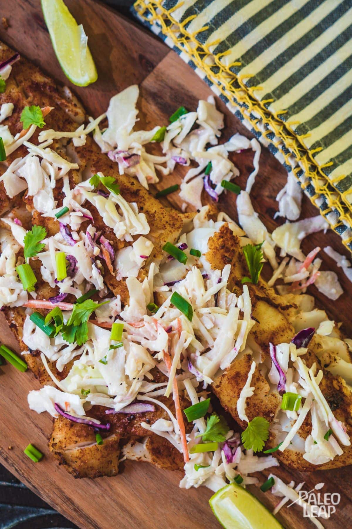 Spicy Fish With Cabbage Slaw on a wooden board.