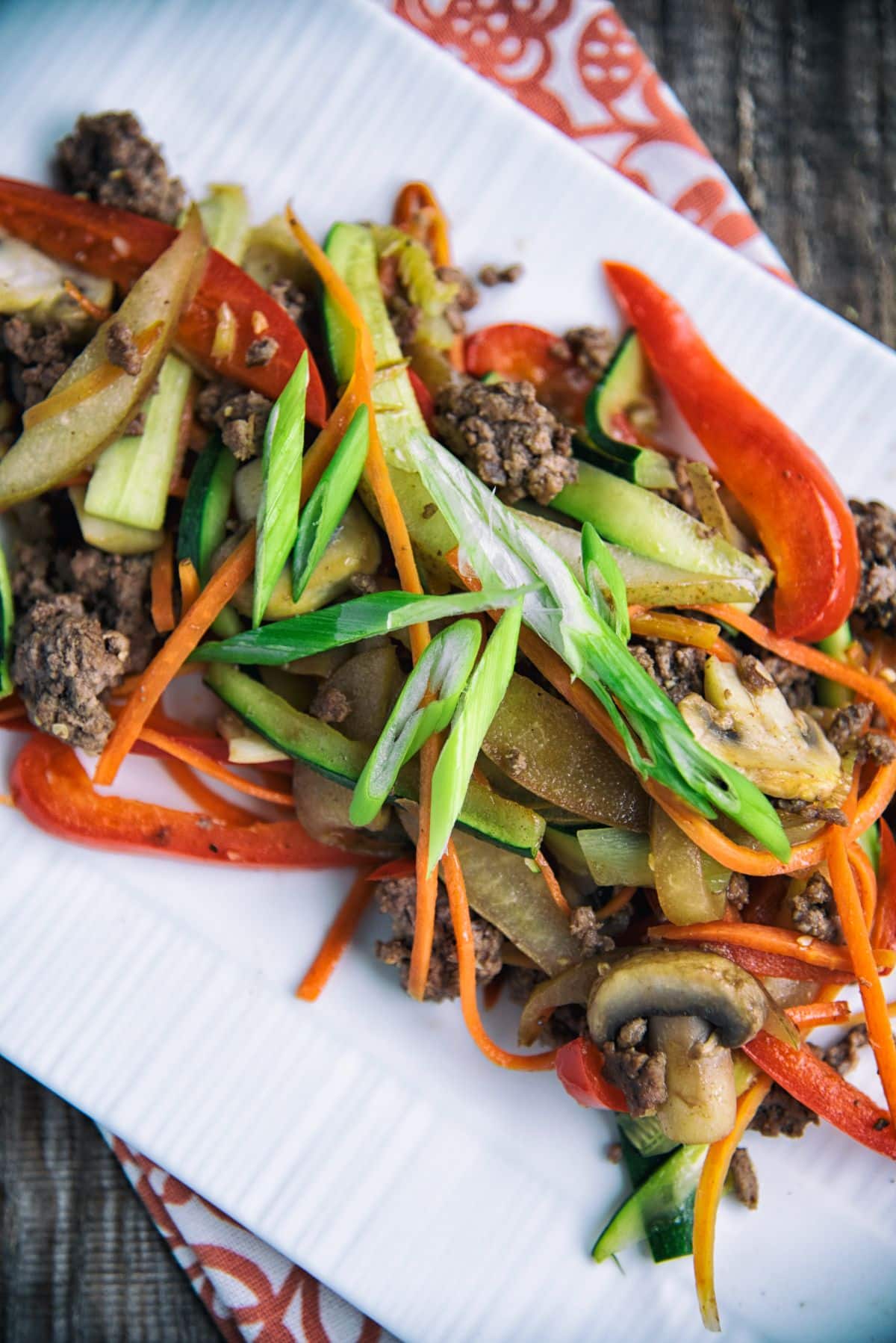 Pear And Bell Pepper Ground Beef Stir-Fry on a white tray.
