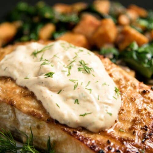 Grilled Salmon with Tartar Sauce and Sweet Potatoes on a plate.