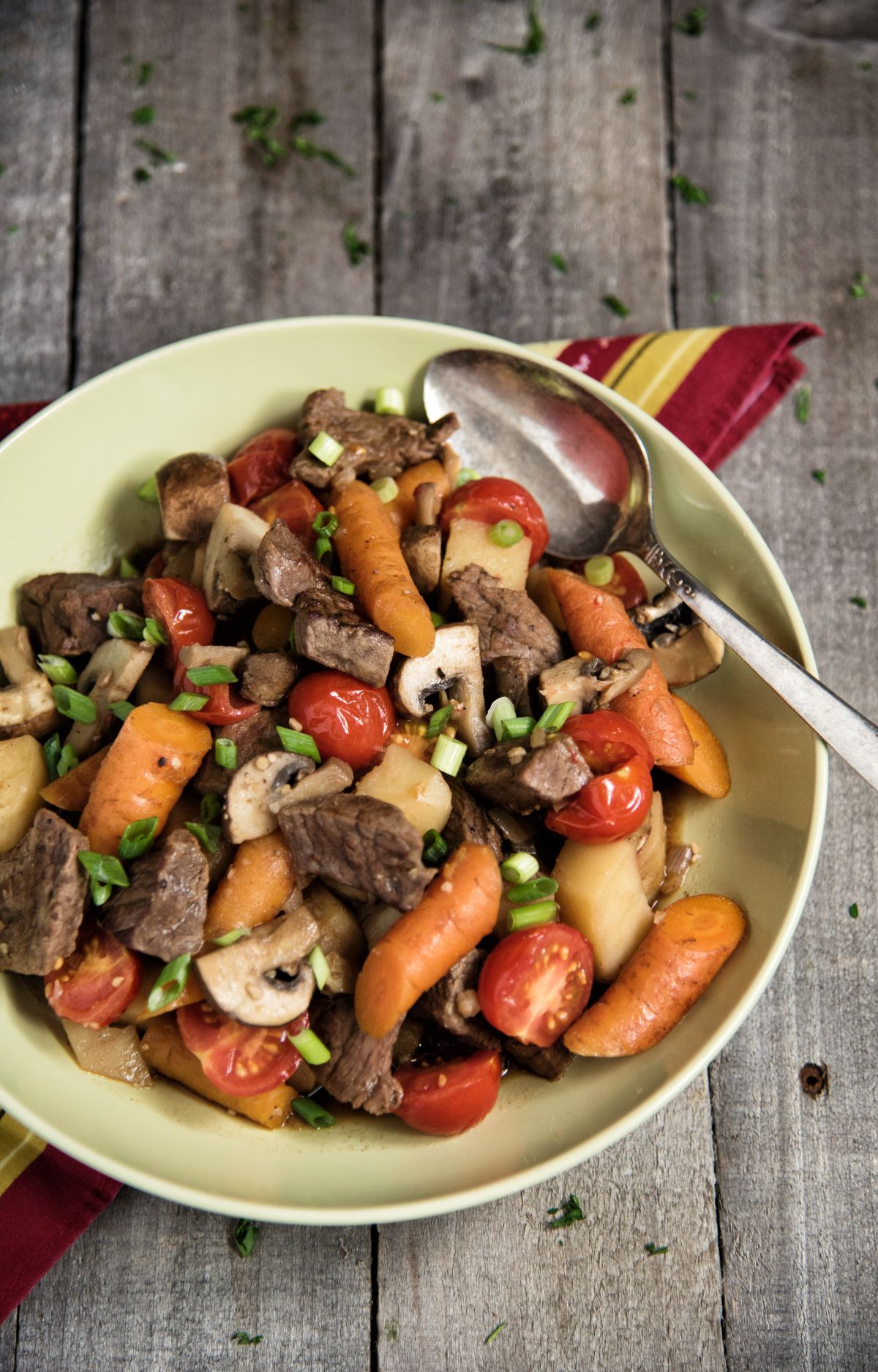 Beef and Vegetable Skillet on a plate with a spoon.