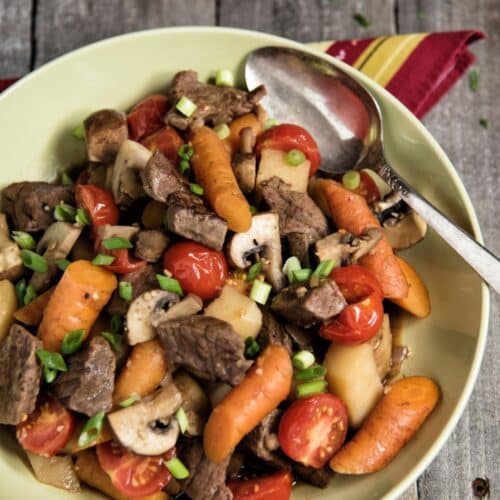 Beef and Vegetable Skillet on a plate with a spoon.
