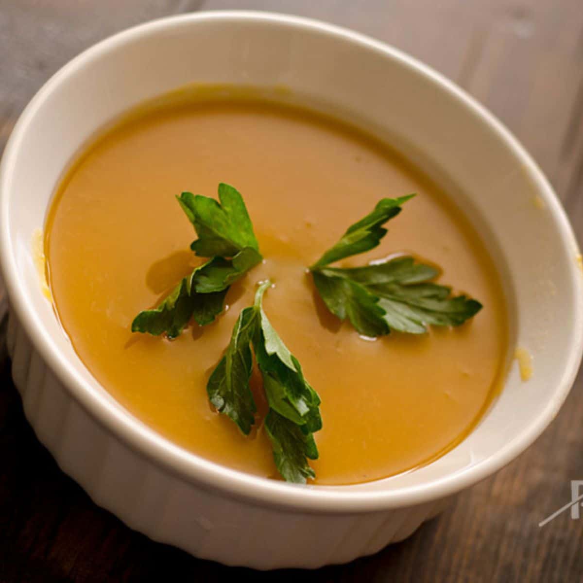 Slow Cooker Butternut Squash Soup in a white bowl.