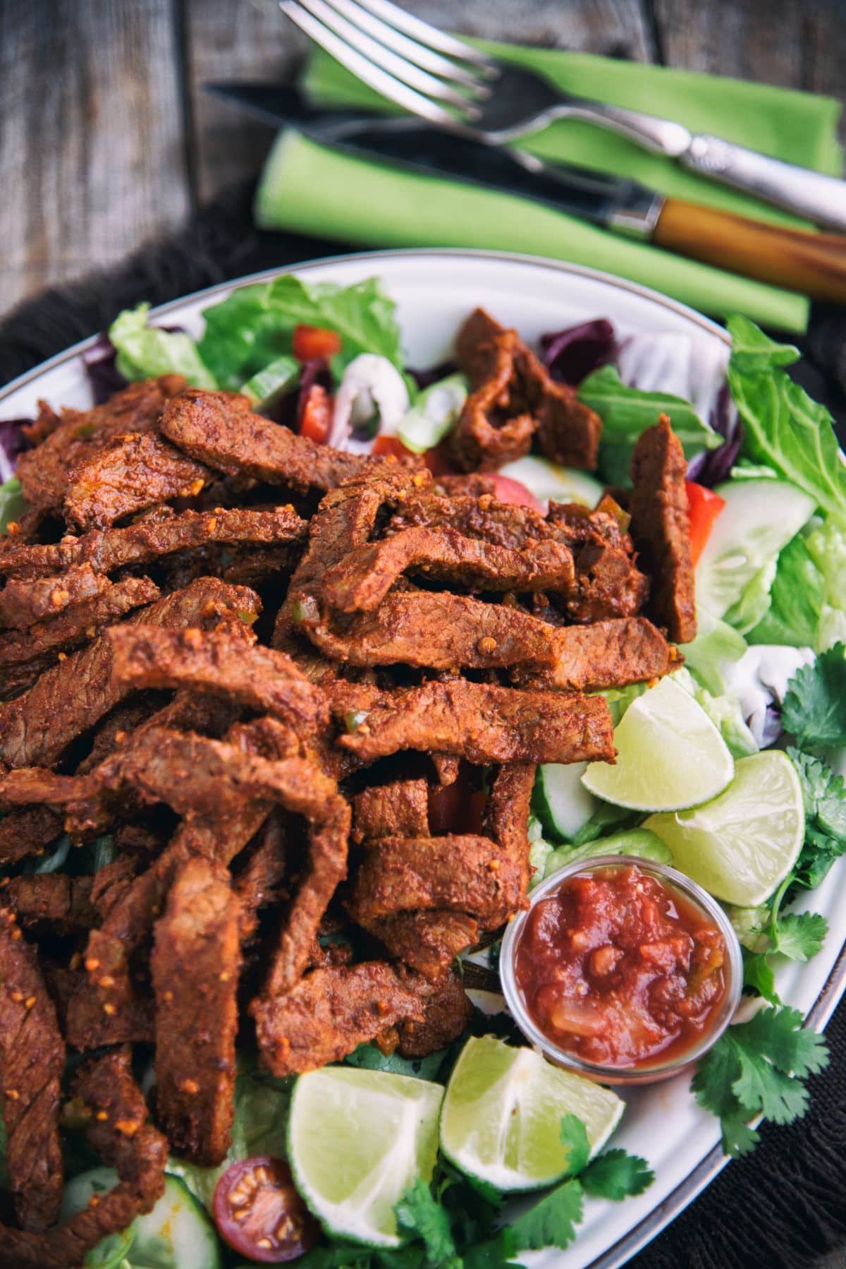 Steak Enchilada Salad on a white tray.