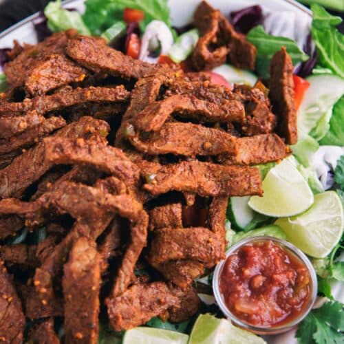 Steak Enchilada Salad on a white tray.