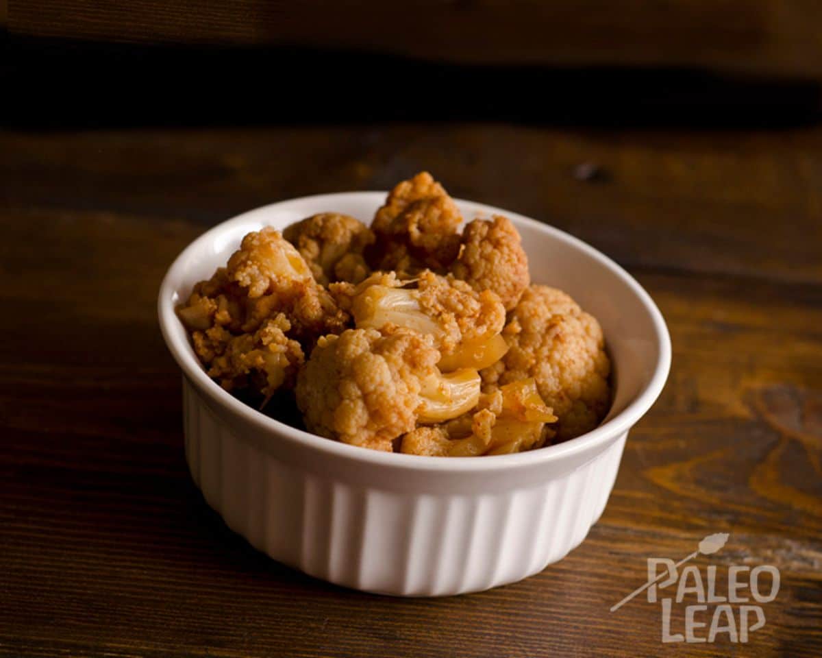 Slow Cooker Curried Cauliflower in a white bowl.