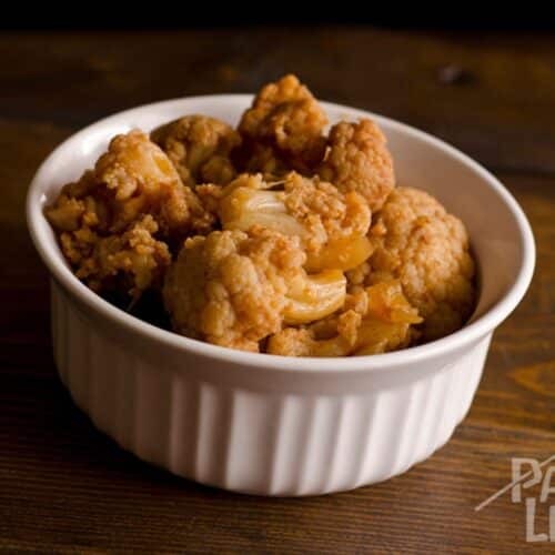 Slow Cooker Curried Cauliflower in a white bowl.