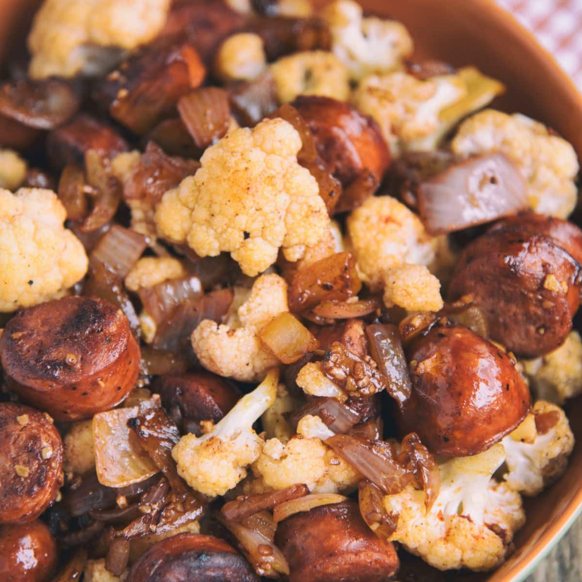 Sausage And Cauliflower Stir-Fry in a bowl.